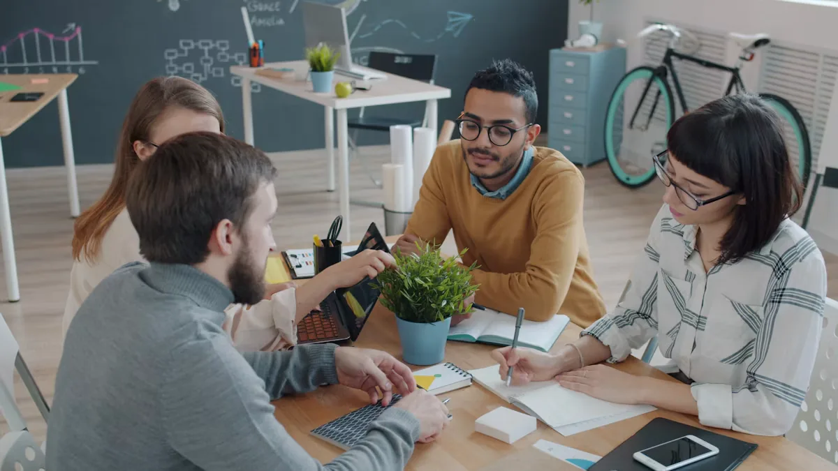 A team collaborating and reviewing plans together at a table