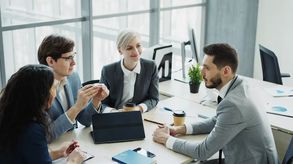 A team discussing plans together around a table in a modern office